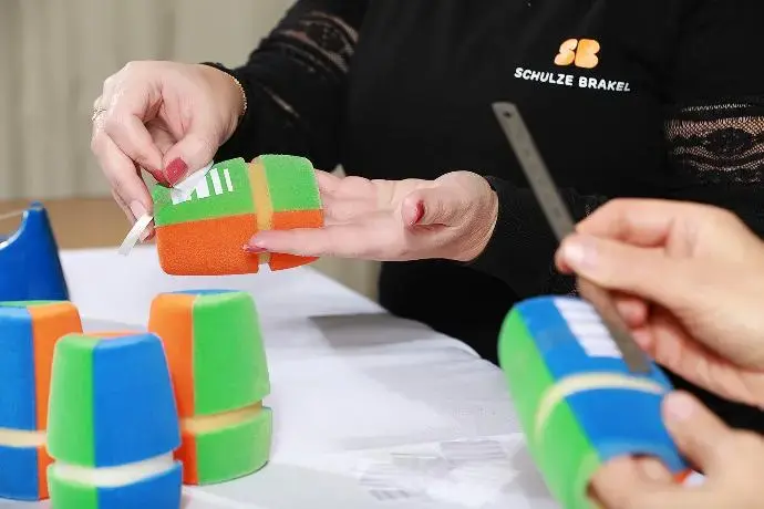 A client inquiring about custom microphone flags from a specialist.